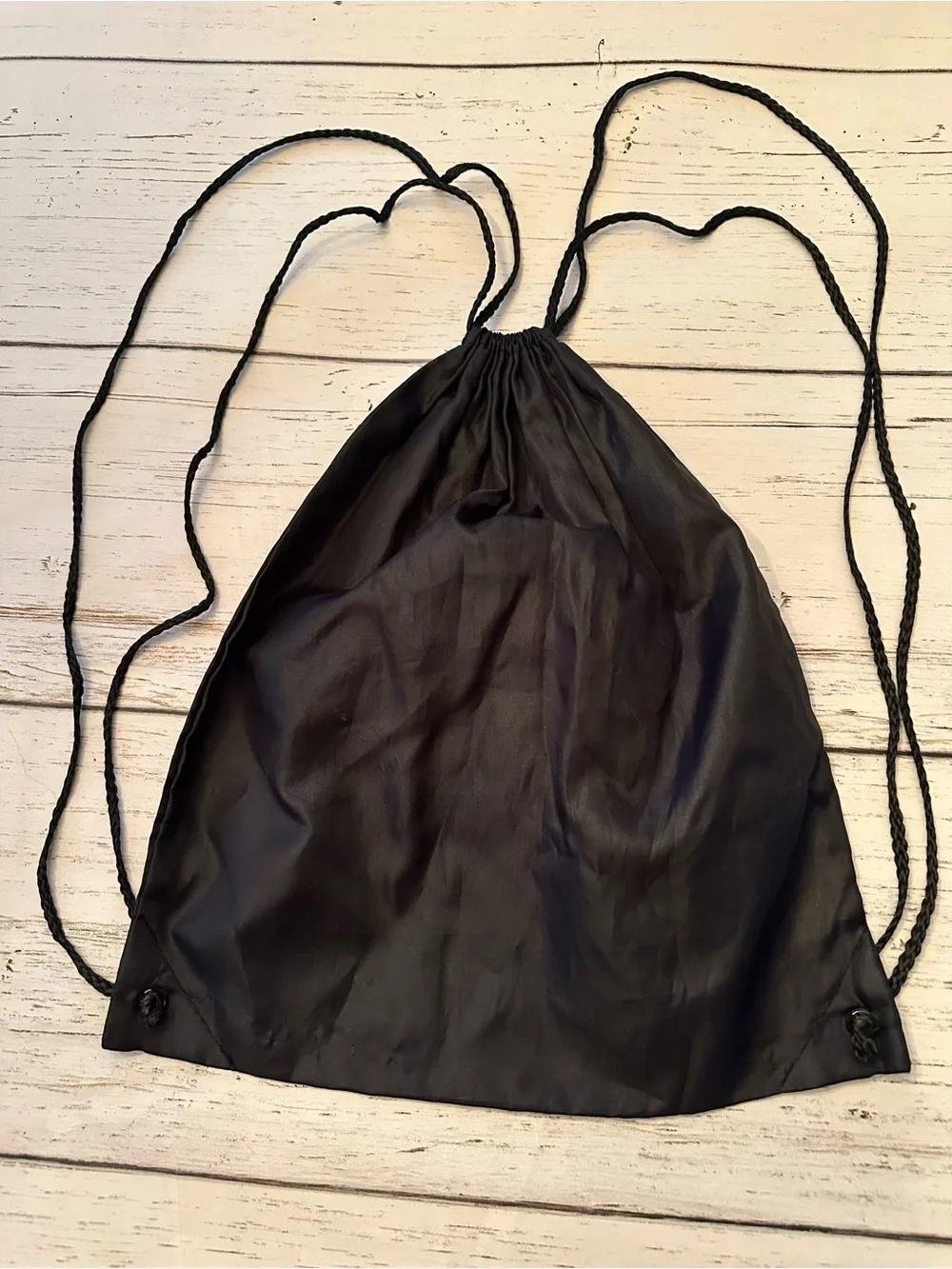 Black Drawstring Backpack with White Text Logo